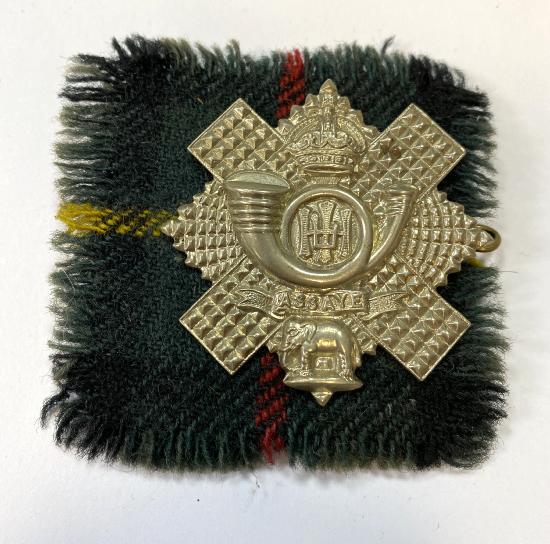 WW2 British Highland Light Infantry Cap Badge With Tartan Backing Cloths