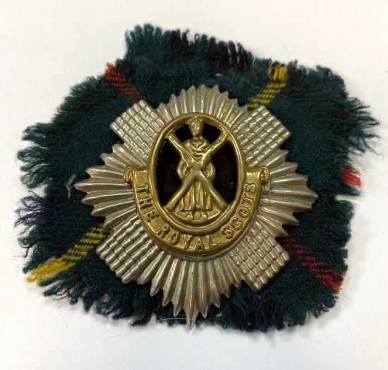 WW2 British Royal Scots Cap Badge With Tartan Backing Cloth